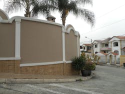 Decorative wall surrounding gated community Decorative wall surrounding gated community